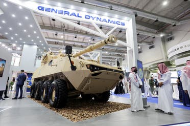 Saudi men are seen at General Dynamics stand displaying the latest defence system at World Defense Show in Riyadh, Saudi Arabia, March 6, 2022. (Reuters)