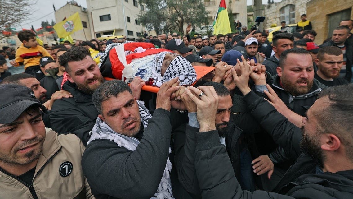 Mourners carry the body of Ahmed Seif, who died as a result of injuries sustained four days ago during clashes with Israeli soldiers, during his funeral in the West Bank village of Burqa, north of Nablus, March 9, 2022. (AFP)
