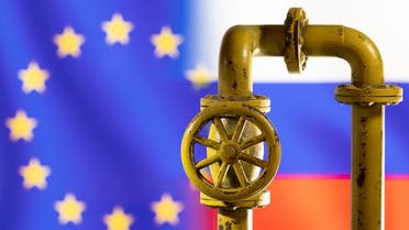 A model of the natural gas pipeline is seen in front of displayed word EU and Russia flag colours in this illustration taken on March 8, 2022. (Reuters)