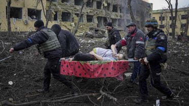 Ukrainian emergency employees and volunteers carry an injured pregnant woman from the damaged by shelling maternity hospital in Mariupol, Ukraine, Wednesday, March 9, 2022. (AP)