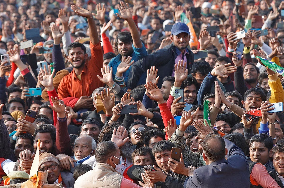 Supporters of India’s ruling Bharatiya Janata Party (BJP) cheer as they listen to Yogi Adityanath, Chief Minister of the northern state of Uttar Pradesh, during an election campaign rally in Bijnor district of the northern state, India, on February 10, 2022. (Reuters)