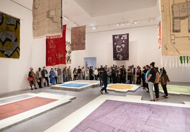 Khalil Rabah, On what grounds, 2022. Handwoven wool rugs, cement tiles; dimensions variable. Installation view: Sharjah Art Foundation, 2022. Photo: Shanavas Jamaluddin