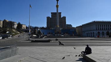 A lonely man sits at Kyiv's Independence Square, the iconic place for the Ukrainians, on February 28, 2022. (AFP)