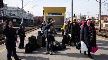 People fleeing the Russian invasion of Ukraine, wait at the train station in Przemysl, Poland, March 12, 2022. REUTERS/Aleksandra Szmigiel