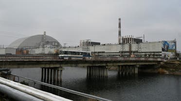 This file photograph taken on December 8, 2020 shows a general view of Chernobyl nuclear power plant and giant protective dome built over the sarcophagus of the destroyed fourth reactor. Ukraine's Chernobyl nuclear plant says 'completely halted' over Russian offensive. (Photo by GENYA SAVILOV / AFP) / NO USE AFTER MARCH 26, 2022 18:32:19 GMT