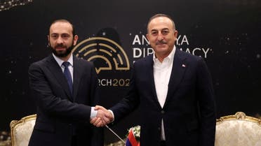 Turkish Foreign Minister Mevlut Cavusoglu meets with his Armenian counterpart Ararat Mirzoyan during the Antalya Diplomacy Forum (ADF) in Antalya, Turkey March 12, 2022. Turkish Foreign Ministry/Handout via REUTERS ATTENTION EDITORS - THIS PICTURE WAS PROVIDED BY A THIRD PARTY. NO RESALES. NO ARCHIVES.