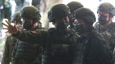 Taiwan President Tsai Ing-wen visits army reservist troop during a training in Nanshipu, Taiwan March 12, 2022. (Reuters)