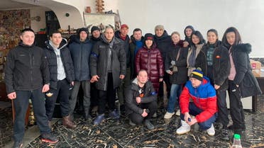 Local resident Teimur Aliev poses with his team of volunteers that deliver food and aid, amid the Russian invasion, in Kharkiv, Ukraine in this undated handout image obtained March 12, 2022. (Reuters)
