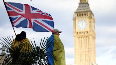 A demonstrator holds a British flag during a protest against Russia's invasion of Ukraine, at Parliament Square in London, Britain, March 6, 2022. (File Photo: Reuters)