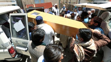 Afghan men carry the coffin of one of polio vaccination health workers shot and killed by unknown gunmen at separate locations in Jalalabad, Afghanistan June 15, 2021. (Reuters)