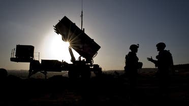 This February 26, 2013 handout photograph courtesy of the US Air Force shows US soldiers with the 3rd Battalion, 2nd Air Defense Artillery Regiment talking after a routine inspection of a Patriot missile battery at a Turkish military base in Gaziantep, Turkey. (File photo: AFP)
