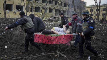 Ukrainian emergency employees and volunteers carry an injured pregnant woman from a maternity hospital that was damaged by shelling in Mariupol, Ukraine, March 9, 2022. (AP)