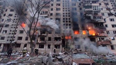 Rescuers work next to a residential building damaged by shelling, as Russia's attack on Ukraine continues, in Kyiv, Ukraine, in this handout picture released March 14, 2022. Press service of the State Emergency Service of Ukraine/Handout via REUTERS ATTENTION EDITORS - THIS IMAGE HAS BEEN SUPPLIED BY A THIRD PARTY.