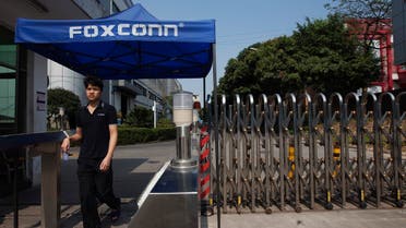A worker leaves a Foxconn factory in the township of Longhua in Shenzhen, Guangdong province. (File photo: Reuters)