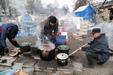 Volunteers prepare food for local residents and members of the Ukrainian Territorial Defence Forces at a field kitchen, as Russia's invasion of Ukraine continues, in Kyiv, Ukraine March 6, 2022. (Reuters)