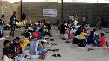 Ethiopian migrants rest before they were flown back to Ethiopia, at an IOM shelter in Aden, Yemen April 13, 2021. Picture taken April 13, 2021. REUTERS/Fawaz Salman