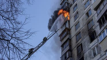 Firefighters work to put out a fire in a residential apartment building after it was hit by shelling as Russia's invasion of Ukraine continues, in Kyiv, Ukraine, March 15, 2022. REUTERS/Marko Djurica TPX IMAGES OF THE DAY