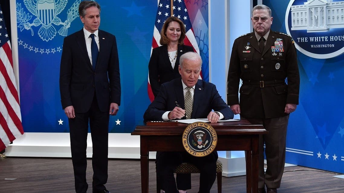 US President Joe Biden signs off for new assistance to Ukraine, March 16, 2022. (AFP)