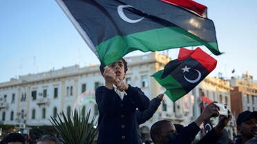 Children wave Libyan flags as they gather during celebrations commemorating the 11th anniversary of the 2011 revolution in Tripoli, Libya February 18, 2022. REUTERS/Nada Harib