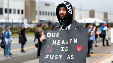 Former Amazon employee Christian Smalls stands with fellow demonstrators during a protest outside of an Amazon warehouse as the outbreak of the coronavirus disease (COVID-19) continues in the Staten Island borough of New York U.S., May 1, 2020. (Reuters)