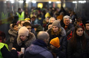 Refugees queue for the last train of the day to Poland after fleeing the ongoing Russian invasion to Ukraine, at the main train station in Lviv, Ukraine, on March 17, 2022. (Reuters)
