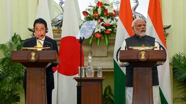 India’s Prime Minister Narendra Modi (R) speaks next to Japan’s Prime Minister Fumio Kishida after the signing of an agreement in New Delhi on March 19, 2022. (AFP)