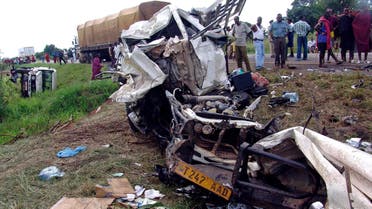 Tanzanians look at the destroyed vehicles involved in a road crash at Chamakweza on the Indian Ocean coast, about 80 km (50 miles) from Dar es Salaam, Tanzania, June 1, 2005. (File photo: Reuters)