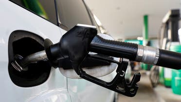 A fuel nozzle is used to fuel up a car at a petrol station in Vienna, Austria March 18, 2022. (Reuters)