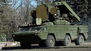 Pro-Russian separatist ride on the 9K33 Osa surface-to-air missile system (NATO reporting name is SA-8 Gecko) in the eastern Ukrainian city of Makeyevka on February 21, 2015. Ukraine's military and pro-Moscow rebels swapped scores of prisoners in rare compliance with a truce so badly breached over the past week that the US warned it could escalate sanctions on Russia within days. AFP PHOTO / VASILY MAXIMOV (Photo by VASILY MAXIMOV / AFP)
