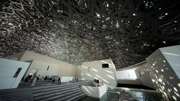 Visitors look at the dome hall design of the Louvre Abu Dhabi Museum in Abu Dhabi, United Arab Emirates, December 25, 2018. Picture taken December 25, 2018. (Reuters)