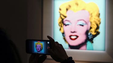 Andy Warhol's Shot Sage Blue Marilyn, a painting of Marilyn Monroe, is pictured on display at Christie's Auction House in advance of the piece going up for auction in the Manhattan borough of New York City, New York, U.S., March 21, 2022. REUTERS/Carlo Allegri