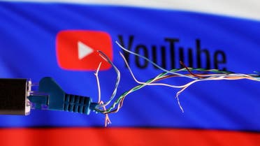 Broken Ethernet cable is seen in front of Russian flag and Youtube logo in this illustration taken March 11, 2022. (Reuters)