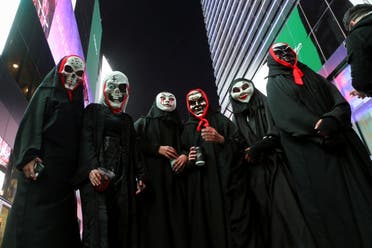 Residents of Riyadh dressed in costumes pose for a picture, as they take part in a two-day costume event in Riyadh, Saudi Arabia, March 17, 2022. Picture taken March 17, 2022. (Reuters)