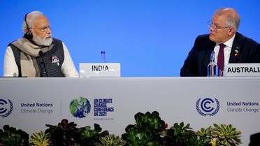 India’s Prime Minister Narendra Modi, and Australia’s Prime Minister Scott Morrison attend a meeting during the UN Climate Change Conference (COP26) in Glasgow, Scotland, Britain, on November 2, 2021. (Reuters)