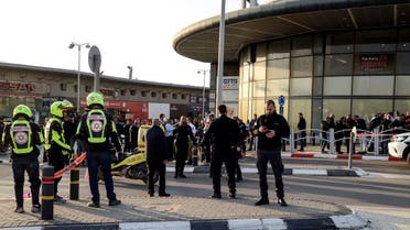 Israeli security and rescue forces secure the scene of an attack in which people were killed near a shopping center in Beersheba, Israel, on March 22, 2022. (Reuters)