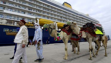Tunisian authorities lay on camels for passengers on the first cruise ship to dock since 2019, hopeful that it signals the start of a post-Covid recovery in tourism. (AFP)