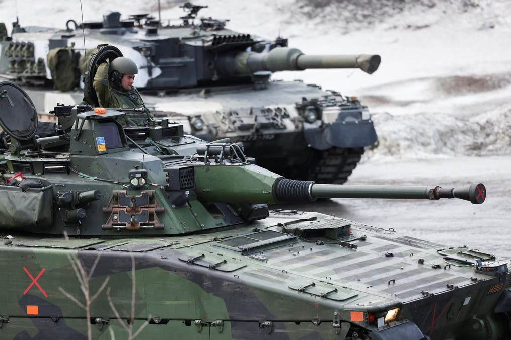 Swedish and Finnish tanks are seen during a military exercise called Cold Response 2022, gathering around 30,000 troops from NATO member countries plus Finland and Sweden, amid Russia's invasion of Ukraine, in Evenes, Norway, March 22, 2022. REUTERS/Yves Herman
