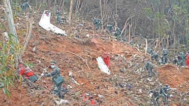 Rescuers search for the black boxes at a plane crash site in Tengxian county of Wuzhou, Guangxi Zhuang Autonomous Region, China March 22, 2022. (Reuters)