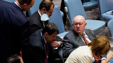 Vasily Nebenzya, Permanent Representative of Russia to the United Nations, right, speaks to members of his entourage during a meeting of the UN Security Council, Wednesday, March 23, 2022, at United Nations headquarters. The United Nations will face three resolutions Wednesday, March 23 on the worsening humanitarian situation in Ukraine after Russia decided to call for a vote on its Security Council resolution that makes no mention of its attack on its smaller neighbor. U.S. Ambassador Linda Thomas-Greenfield said there was no support for Russia's resolution. (AP Photo/John Minchillo)