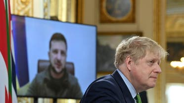 British Prime Minister Boris Johnson listens as Ukrainian President Volodymyr Zelenskiy addresses, by videolink, attendees of the Joint Expeditionary Force meeting, a coalition of 10 states focused on security in northern Europe, at Lancaster House in London, Britain March 15, 2022. (Reuters)