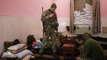 Ukrainian military personnel prepare for a change of guard, in their room at an army barracks, as Russia's invasion of Ukraine continues, in Odessa, Ukraine, March 14, 2022. (Reuters)