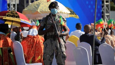 A police officer stands guard during a pro-government rally to denounce what the organisers say is the Tigray People’s Liberation Front (TPLF) and the Western countries' interference in internal affairs of the country, at Meskel Square in Addis Ababa, Ethiopia, November 7, 2021. (Reuters)