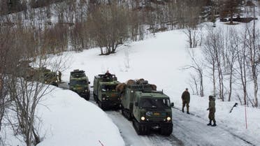 U.S. Marines participate in a military exercise called Cold Response 2022, gathering around 30,000 troops from NATO member countries plus Finland and Sweden, amid Russia's invasion of Ukraine, near Bjerkvik in the Arctic Circle, Norway, March 24, 2022. Picture taken with a drone. REUTERS/Bart Biesemans