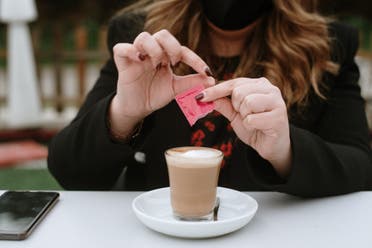 A woman having coffee. (Stock photo) 