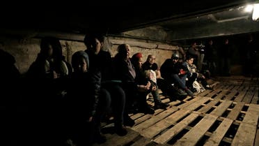 People shelter underground following explosions in Lviv, western Ukraine, March 26, 2022. (AP)