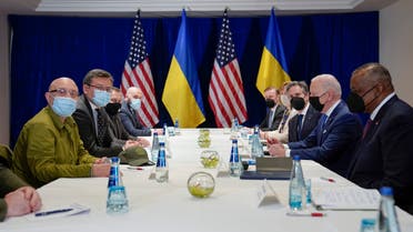 President Joe Biden participates in a meeting with Ukrainian Foreign Minister Dmytro Kuleba, third from left, and Ukrainian Defense Minister Oleksii Reznikov, second from left, Saturday, March 26, 2022, in Warsaw. Defense Secretary Lloyd Austin is at right. (AP Photo/Evan Vucci)