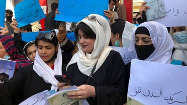 Afghan women chant and hold signs of protest during a demonstration in Kabul, Afghanistan, Saturday, March 26, 2022. Afghanistan's Taliban rulers refused to allow dozens of women to board several flights, including some overseas, because they were traveling without a male guardian, two Afghan airline officials said Saturday. (AP Photo/Mohammed Shoaib Amin)