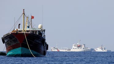 China Coast Guard vessels patrol past a Chinese fishing vessel at the disputed Scarborough Shoal, April 5, 2017. Picture taken April 5, 2017. (File Photo: Reuters)