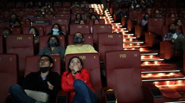 People watch a movie at a PVR Multiplex cinema in New Delhi, India, February 26, 2022.  (Reuters)