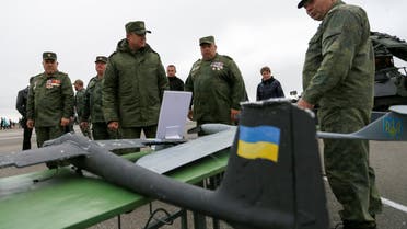 Leonid Pasechnik, head of the self-proclaimed Luhansk People's Republic (LNR), observes unmanned aircraft vehicles (UAV) with Ukrainian insignia, which according to them were shot down by LNR's forces, during a parade marking the 5th anniversary of creation of armed forces, at the airfield in Luhansk, Ukraine October 6, 2019. (File photo: Reuters)